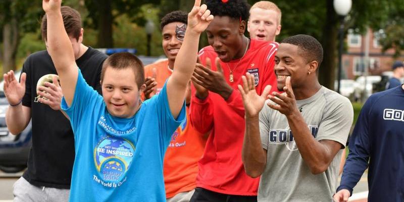 young man getting cheered on by his friends