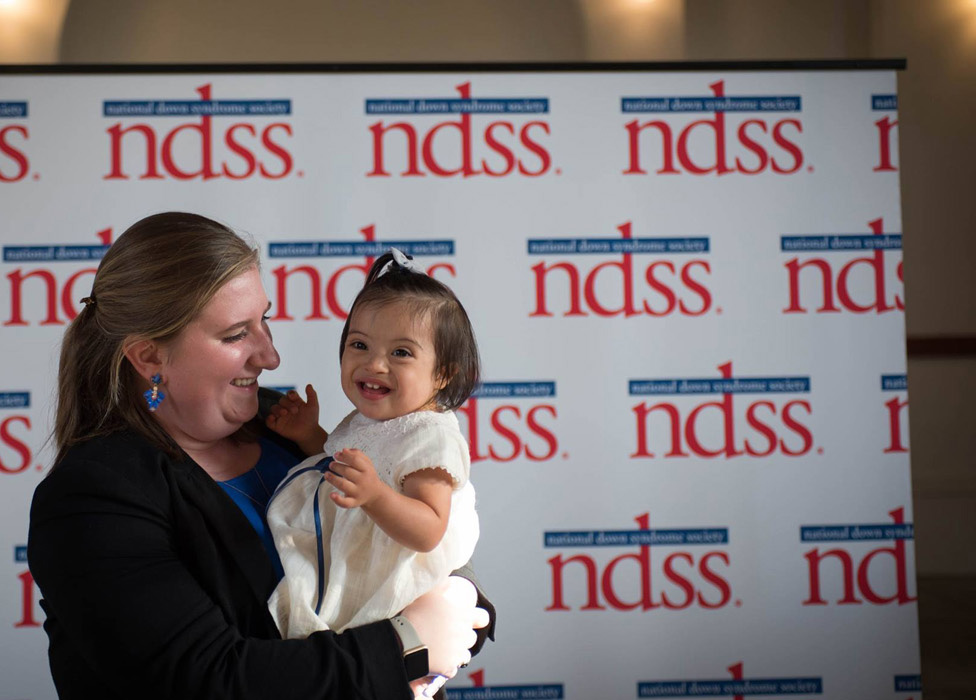 Image: Woman holds child