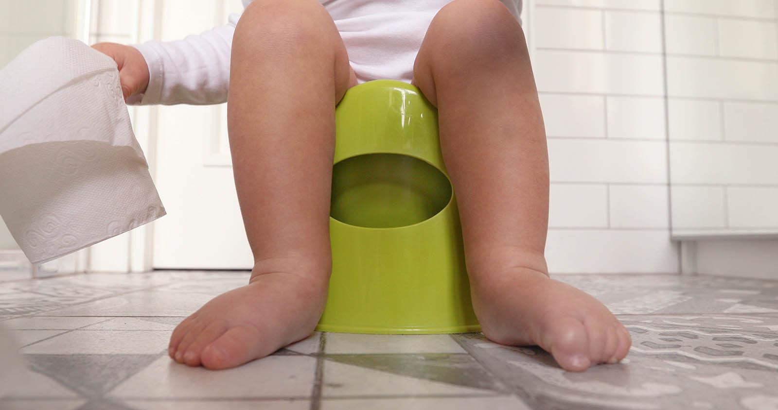 Image of child's feet on a potty