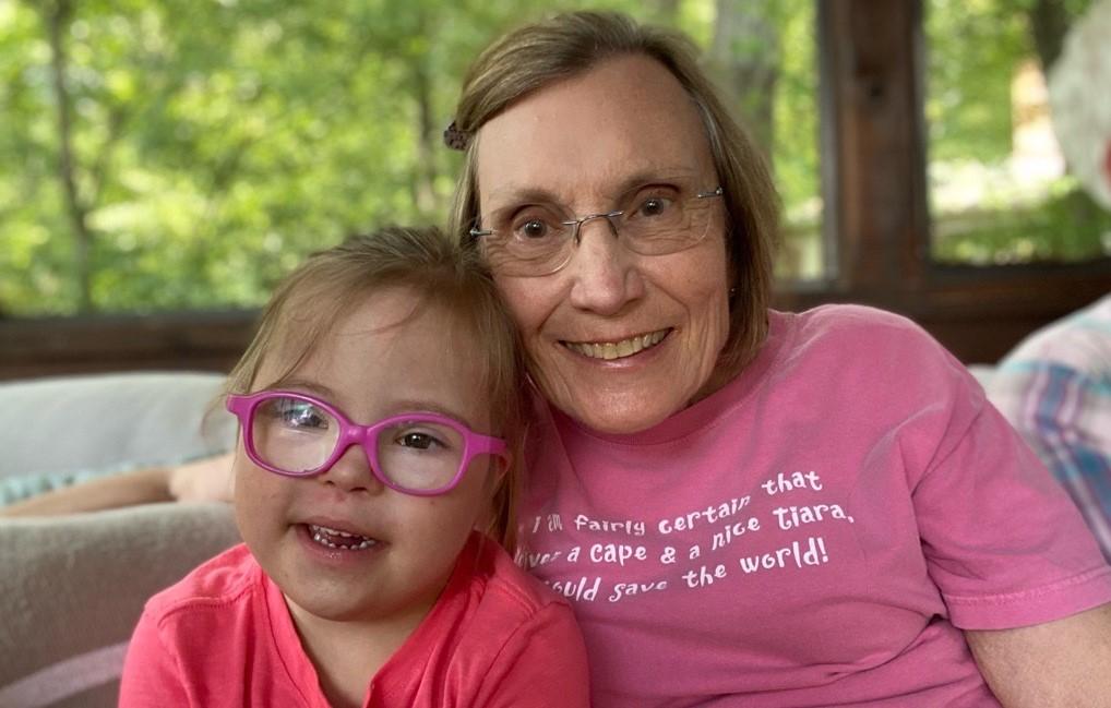 Toddler and her grandma smiling