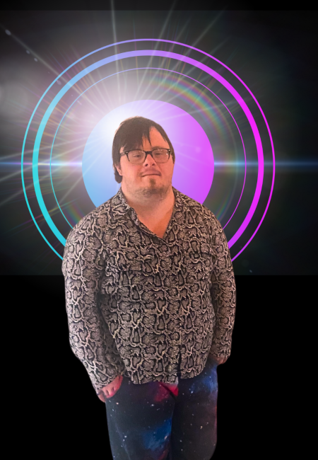 man with down syndrome wears cheetah button up shirt and jeans and smiles at the camera